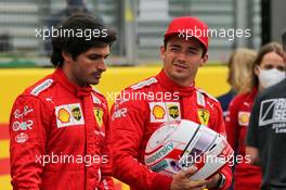(L to R): Carlos Sainz Jr (ESP) Ferrari and team mate Charles Leclerc (MON) Ferrari - 2022 Car Launch. 15.07.2021. Formula 1 World Championship, Rd 10, British Grand Prix, Silverstone, England, Preparation Day.
