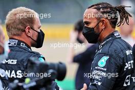 (L to R): Valtteri Bottas (FIN) Mercedes AMG F1 with team mate Lewis Hamilton (GBR) Mercedes AMG F1 - 2022 Car Launch. 15.07.2021. Formula 1 World Championship, Rd 10, British Grand Prix, Silverstone, England, Preparation Day.