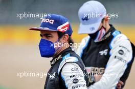 (L to R): Fernando Alonso (ESP) Alpine F1 Team and team mate Esteban Ocon (FRA) Alpine F1 Team - 2022 Car Launch. 15.07.2021. Formula 1 World Championship, Rd 10, British Grand Prix, Silverstone, England, Preparation Day.