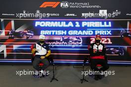 (L to R): Yuki Tsunoda (JPN) AlphaTauri and Kimi Raikkonen (FIN) Alfa Romeo Racing in the FIA Press Conference. 15.07.2021. Formula 1 World Championship, Rd 10, British Grand Prix, Silverstone, England, Preparation Day.