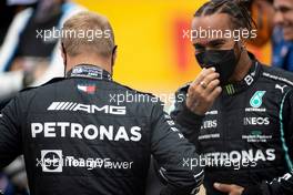 (L to R): Valtteri Bottas (FIN) Mercedes AMG F1 and team mate Lewis Hamilton (GBR) Mercedes AMG F1 - 2022 Car Launch. 15.07.2021. Formula 1 World Championship, Rd 10, British Grand Prix, Silverstone, England, Preparation Day.