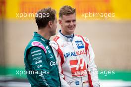 (L to R): Sebastian Vettel (GER) Aston Martin F1 Team and Mick Schumacher (GER) Haas F1 Team - 2022 Car Launch. 15.07.2021. Formula 1 World Championship, Rd 10, British Grand Prix, Silverstone, England, Preparation Day.