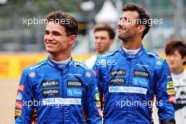 (L to R): Lando Norris (GBR) McLaren and Daniel Ricciardo (AUS) McLaren - 2022 Car Launch. 15.07.2021. Formula 1 World Championship, Rd 10, British Grand Prix, Silverstone, England, Preparation Day.
