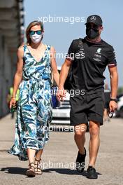 Valtteri Bottas (FIN) Mercedes AMG F1 with his girlfriend Tiffany Cromwell (AUS) Professional Cyclist. 30.07.2021. Formula 1 World Championship, Rd 11, Hungarian Grand Prix, Budapest, Hungary, Practice Day.