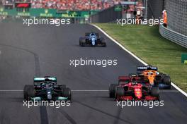 Carlos Sainz Jr (ESP) Ferrari SF-21 and Lewis Hamilton (GBR) Mercedes AMG F1 W12 battle for position. 01.08.2021. Formula 1 World Championship, Rd 11, Hungarian Grand Prix, Budapest, Hungary, Race Day.