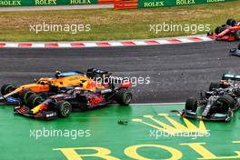 (L to R): Lando Norris (GBR) McLaren MCL35M, Max Verstappen (NLD) Red Bull Racing RB16B and Valtteri Bottas (FIN) Mercedes AMG F1 W12 - crash at the start of the race. 01.08.2021. Formula 1 World Championship, Rd 11, Hungarian Grand Prix, Budapest, Hungary, Race Day.