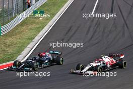 Lewis Hamilton (GBR) Mercedes AMG F1 W12 and Antonio Giovinazzi (ITA) Alfa Romeo Racing C41 battle for position. 01.08.2021. Formula 1 World Championship, Rd 11, Hungarian Grand Prix, Budapest, Hungary, Race Day.