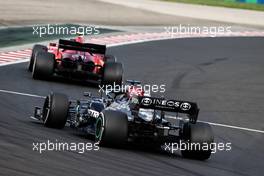 Carlos Sainz Jr (ESP) Ferrari SF-21 leads Lewis Hamilton (GBR) Mercedes AMG F1 W12. 01.08.2021. Formula 1 World Championship, Rd 11, Hungarian Grand Prix, Budapest, Hungary, Race Day.