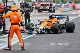 Lando Norris (GBR) McLaren MCL35M makes a pit stop. 01.08.2021. Formula 1 World Championship, Rd 11, Hungarian Grand Prix, Budapest, Hungary, Race Day.