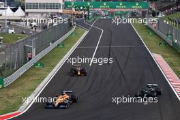 Daniel Ricciardo (AUS) McLaren MCL35M leads Lewis Hamilton (GBR) Mercedes AMG F1 W12 and Max Verstappen (NLD) Red Bull Racing RB16B. 01.08.2021. Formula 1 World Championship, Rd 11, Hungarian Grand Prix, Budapest, Hungary, Race Day.