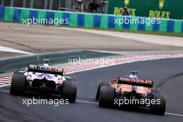 Mick Schumacher (GER) Haas VF-21 and Daniel Ricciardo (AUS) McLaren MCL35M battle for position. 01.08.2021. Formula 1 World Championship, Rd 11, Hungarian Grand Prix, Budapest, Hungary, Race Day.
