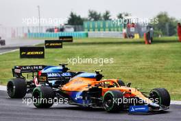 Lando Norris (GBR) McLaren MCL35M with damaged front wing at the start of the race. 01.08.2021. Formula 1 World Championship, Rd 11, Hungarian Grand Prix, Budapest, Hungary, Race Day.