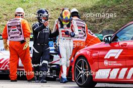 Mick Schumacher (GER) Haas VF-21 with Dr Ian Roberts (GBR) FIA Doctor after he crashed in the second practice session. 31.07.2021. Formula 1 World Championship, Rd 11, Hungarian Grand Prix, Budapest, Hungary, Qualifying Day.