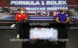 (L to R): Carlos Sainz Jr (ESP) Ferrari and Esteban Ocon (FRA) Alpine F1 Team in the FIA Press Conference. 29.07.2021. Formula 1 World Championship, Rd 11, Hungarian Grand Prix, Budapest, Hungary, Preparation Day.