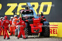 Marshals remove the Ferrari SF-21 of Charles Leclerc (MON), who crashed in the second practice session. 16.04.2021. Formula 1 World Championship, Rd 2, Emilia Romagna Grand Prix, Imola, Italy, Practice Day.