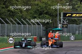 (L to R): Lewis Hamilton (GBR) Mercedes AMG F1 W12 and Daniel Ricciardo (AUS) McLaren MCL35M battle for position. 18.04.2021. Formula 1 World Championship, Rd 2, Emilia Romagna Grand Prix, Imola, Italy, Race Day.
