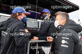 (L to R): Fernando Alonso (ESP) Alpine F1 Team with Esteban Ocon (FRA) Alpine F1 Team and Marcin Budkowski (POL) Alpine F1 Team Executive Director. 18.04.2021. Formula 1 World Championship, Rd 2, Emilia Romagna Grand Prix, Imola, Italy, Race Day.