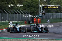 (L to R): Lance Stroll (CDN) Aston Martin F1 Team AMR21 and Lewis Hamilton (GBR) Mercedes AMG F1 W12 battle for position. 18.04.2021. Formula 1 World Championship, Rd 2, Emilia Romagna Grand Prix, Imola, Italy, Race Day.