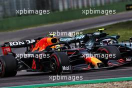 (L to R): Sergio Perez (MEX) Red Bull Racing RB16B and Sebastian Vettel (GER) Aston Martin F1 Team AMR21 battle for position. 18.04.2021. Formula 1 World Championship, Rd 2, Emilia Romagna Grand Prix, Imola, Italy, Race Day.