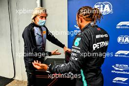 Pole sitter Lewis Hamilton (GBR) Mercedes AMG F1 with Roberto Boccafogli (ITA) Pirelli Head of F1 Communications. 17.04.2021. Formula 1 World Championship, Rd 2, Emilia Romagna Grand Prix, Imola, Italy, Qualifying Day.