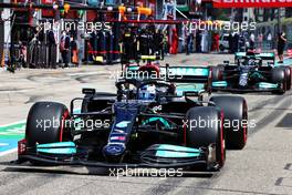 Valtteri Bottas (FIN) Mercedes AMG F1 W12 leads Lewis Hamilton (GBR) Mercedes AMG F1 W12 out of the pits. 17.04.2021. Formula 1 World Championship, Rd 2, Emilia Romagna Grand Prix, Imola, Italy, Qualifying Day.