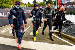 (L to R): Max Verstappen (NLD) Red Bull Racing with Sergio Perez (MEX) Red Bull Racing; Lewis Hamilton (GBR) Mercedes AMG F1; and Angela Cullen (NZL) Mercedes AMG F1 Physiotherapist. 17.04.2021. Formula 1 World Championship, Rd 2, Emilia Romagna Grand Prix, Imola, Italy, Qualifying Day.