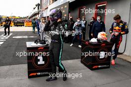 Pole sitter Lewis Hamilton (GBR) Mercedes AMG F1 and third placed Max Verstappen (NLD) Red Bull Racing in qualifying parc ferme. 17.04.2021. Formula 1 World Championship, Rd 2, Emilia Romagna Grand Prix, Imola, Italy, Qualifying Day.