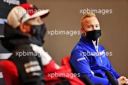 Nikita Mazepin (RUS) Haas F1 Team and Kimi Raikkonen (FIN) Alfa Romeo Racing in the FIA Press Conference. 15.04.2021. Formula 1 World Championship, Rd 2, Emilia Romagna Grand Prix, Imola, Italy, Preparation Day.