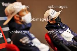 Yuki Tsunoda (JPN) AlphaTauri with team mate Pierre Gasly (FRA) AlphaTauri in the FIA Press Conference. 15.04.2021. Formula 1 World Championship, Rd 2, Emilia Romagna Grand Prix, Imola, Italy, Preparation Day.