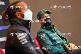 Sebastian Vettel (GER) Aston Martin F1 Team with Lewis Hamilton (GBR) Mercedes AMG F1 in the FIA Press Conference. 15.04.2021. Formula 1 World Championship, Rd 2, Emilia Romagna Grand Prix, Imola, Italy, Preparation Day.