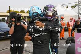 (L to R): Valtteri Bottas (FIN) Mercedes AMG F1 celebrates being fastest in qualifying in parc ferme with team mate Lewis Hamilton (GBR) Mercedes AMG F1. 10.09.2021. Formula 1 World Championship, Rd 14, Italian Grand Prix, Monza, Italy, Qualifying Day.