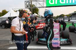 Valtteri Bottas (FIN) Mercedes AMG F1 celebrates being fastest in qualifying in parc ferme with Max Verstappen (NLD) Red Bull Racing. 10.09.2021. Formula 1 World Championship, Rd 14, Italian Grand Prix, Monza, Italy, Qualifying Day.