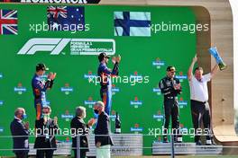 The podium (L to R): Lando Norris (GBR) McLaren, second; Daniel Ricciardo (AUS) McLaren, race winner; Valtteri Bottas (FIN) Mercedes AMG F1, third; Zak Brown (USA) McLaren Executive Director. 12.09.2021. Formula 1 World Championship, Rd 14, Italian Grand Prix, Monza, Italy, Race Day.