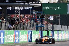 Race winner Daniel Ricciardo (AUS) McLaren MCL35M celebrates as he takes the chequered flag at the end of the race. 12.09.2021. Formula 1 World Championship, Rd 14, Italian Grand Prix, Monza, Italy, Race Day.