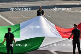 Circuit atmosphere - Large Italian flag held by Lamont Marcell Jacobs (ITA) 2020 Olympic 100m Champion. 12.09.2021. Formula 1 World Championship, Rd 14, Italian Grand Prix, Monza, Italy, Race Day.