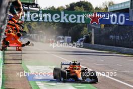 Lando Norris (GBR) McLaren celebrates his second position as he passes the team at the end of the race. 12.09.2021. Formula 1 World Championship, Rd 14, Italian Grand Prix, Monza, Italy, Race Day.