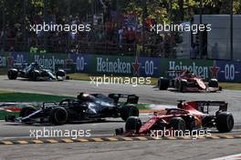 Valtteri Bottas (FIN) Mercedes AMG F1 W12 and Charles Leclerc (MON) Ferrari SF-21 battle for position. 12.09.2021. Formula 1 World Championship, Rd 14, Italian Grand Prix, Monza, Italy, Race Day.