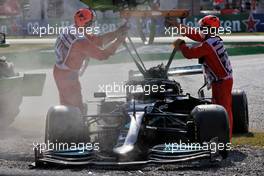 The damaged Mercedes AMG F1 W12 of Lewis Hamilton (GBR) is removed from the circuit after he crashed out of the race. 12.09.2021. Formula 1 World Championship, Rd 14, Italian Grand Prix, Monza, Italy, Race Day.