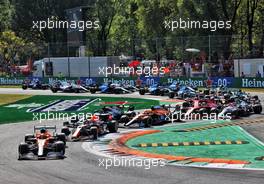 Daniel Ricciardo (AUS) McLaren MCL35M leads at the start of the race. 12.09.2021. Formula 1 World Championship, Rd 14, Italian Grand Prix, Monza, Italy, Race Day.