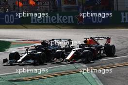 Max Verstappen (NLD) Red Bull Racing RB16B and Lewis Hamilton (GBR) Mercedes AMG F1 W12 crash at the first chicane. 12.09.2021. Formula 1 World Championship, Rd 14, Italian Grand Prix, Monza, Italy, Race Day.