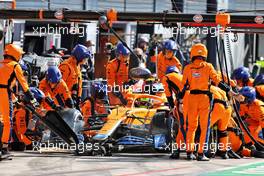 Lando Norris (GBR) McLaren MCL35M makes a pit stop. 12.09.2021. Formula 1 World Championship, Rd 14, Italian Grand Prix, Monza, Italy, Race Day.