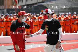 (L to R): Charles Leclerc (MON) Ferrari with Antonio Giovinazzi (ITA) Alfa Romeo Racing on the grid. 23.05.2021. Formula 1 World Championship, Rd 5, Monaco Grand Prix, Monte Carlo, Monaco, Race Day.