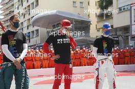 (L to R): Sebastian Vettel (GER) Aston Martin F1 Team with Charles Leclerc (MON) Ferrari and Mick Schumacher (GER) Haas F1 Team on the grid. 23.05.2021. Formula 1 World Championship, Rd 5, Monaco Grand Prix, Monte Carlo, Monaco, Race Day.