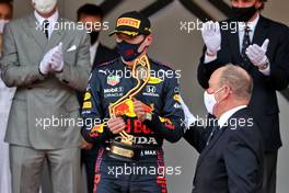 Race winner Max Verstappen (NLD) Red Bull Racing celebrates on the podium with HSH Prince Albert of Monaco (MON). 23.05.2021. Formula 1 World Championship, Rd 5, Monaco Grand Prix, Monte Carlo, Monaco, Race Day.