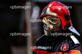 Fernando Alonso (ESP) Alpine F1 Team A521 reflected in a fire marshal's helmet. 23.05.2021. Formula 1 World Championship, Rd 5, Monaco Grand Prix, Monte Carlo, Monaco, Race Day.