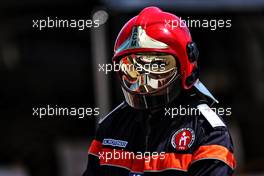 Mick Schumacher (GER) Haas VF-21 reflected in a fire marshal's helmet. 23.05.2021. Formula 1 World Championship, Rd 5, Monaco Grand Prix, Monte Carlo, Monaco, Race Day.