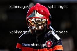 Nikita Mazepin (RUS) Haas F1 Team VF-21 reflected in a fire marshal's helmet. 23.05.2021. Formula 1 World Championship, Rd 5, Monaco Grand Prix, Monte Carlo, Monaco, Race Day.