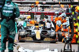 Lando Norris (GBR) McLaren MCL35M makes a pit stop. 23.05.2021. Formula 1 World Championship, Rd 5, Monaco Grand Prix, Monte Carlo, Monaco, Race Day.