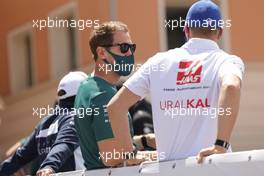 (L to R): Sebastian Vettel (GER) Aston Martin F1 Team with Mick Schumacher (GER) Haas F1 Team on the drivers parade. 23.05.2021. Formula 1 World Championship, Rd 5, Monaco Grand Prix, Monte Carlo, Monaco, Race Day.