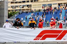 (L to R): Lewis Hamilton (GBR) Mercedes AMG F1; Daniel Ricciardo (AUS) McLaren; and Charles Leclerc (MON) Ferrari on the drivers parade. 23.05.2021. Formula 1 World Championship, Rd 5, Monaco Grand Prix, Monte Carlo, Monaco, Race Day.